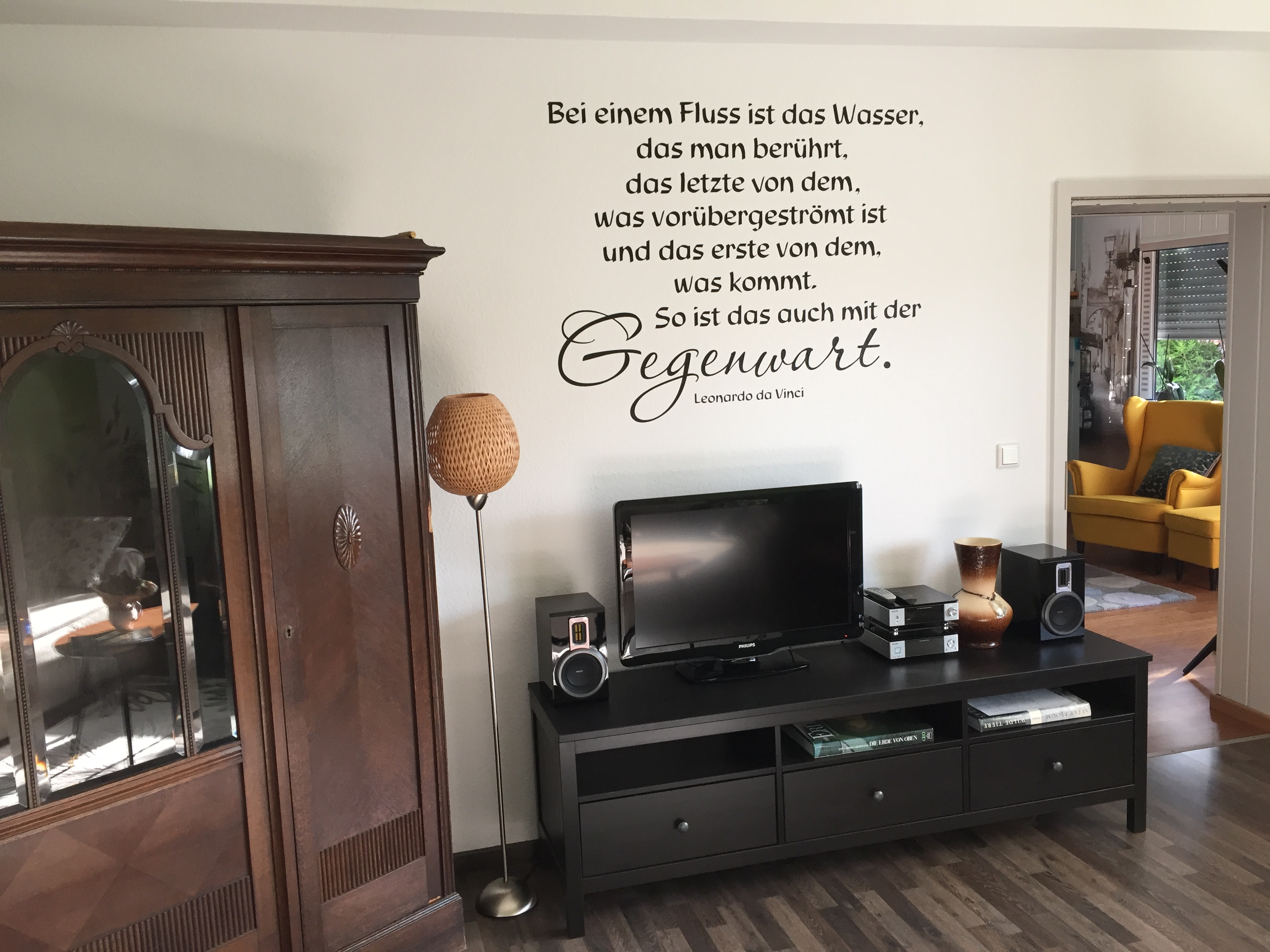Living room with quote on the wall and TV sideboard